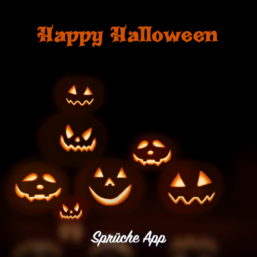 Leuchtende Kürbisse in der Dunkelheit mit Spruch "Happy Halloween"