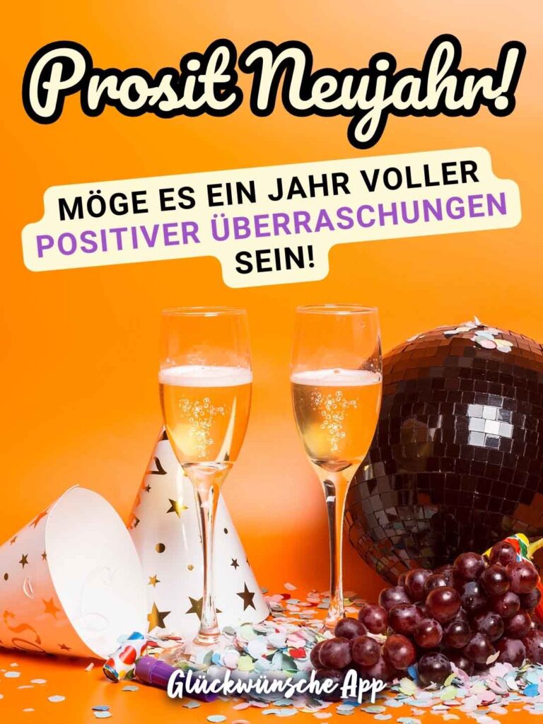 Zwei Sektgläser und Konfetti mit Gruß: „Prosit Neujahr! Möge es ein Jahr voller positiver Überraschungen sein!"