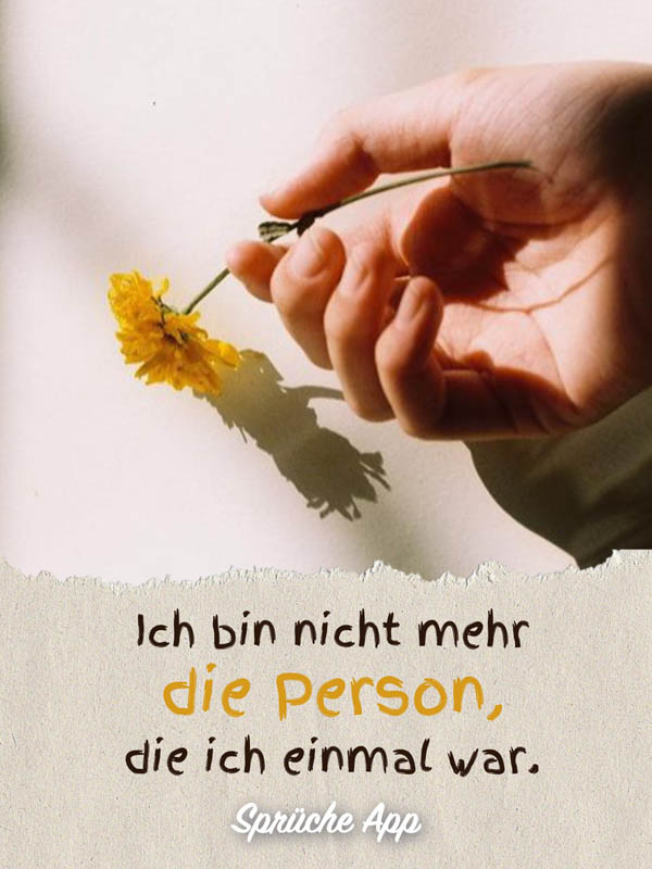 Hand, die eine Blume hält mit Spruch: „Ich bin nicht mehr die Person, die ich einmal war."