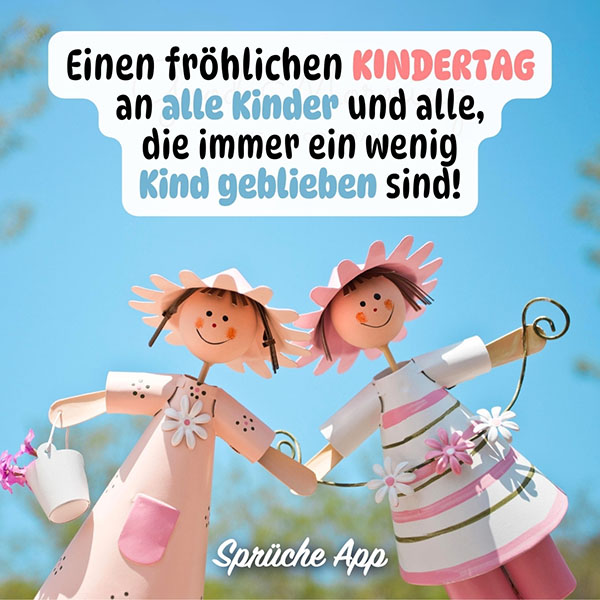 Zwei Damen als Figuren mit Spruch zum Kindertag: „Einen fröhlichen Kindertag an alle Kinder und alle, die immer ein wenig Kind geblieben sind!"