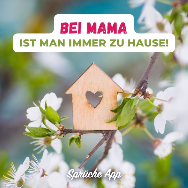 Kleines Holzhaus mit Herz auf einem blühenden Zweig mit Text: „Bei Mama ist man immer zu Hause!"
